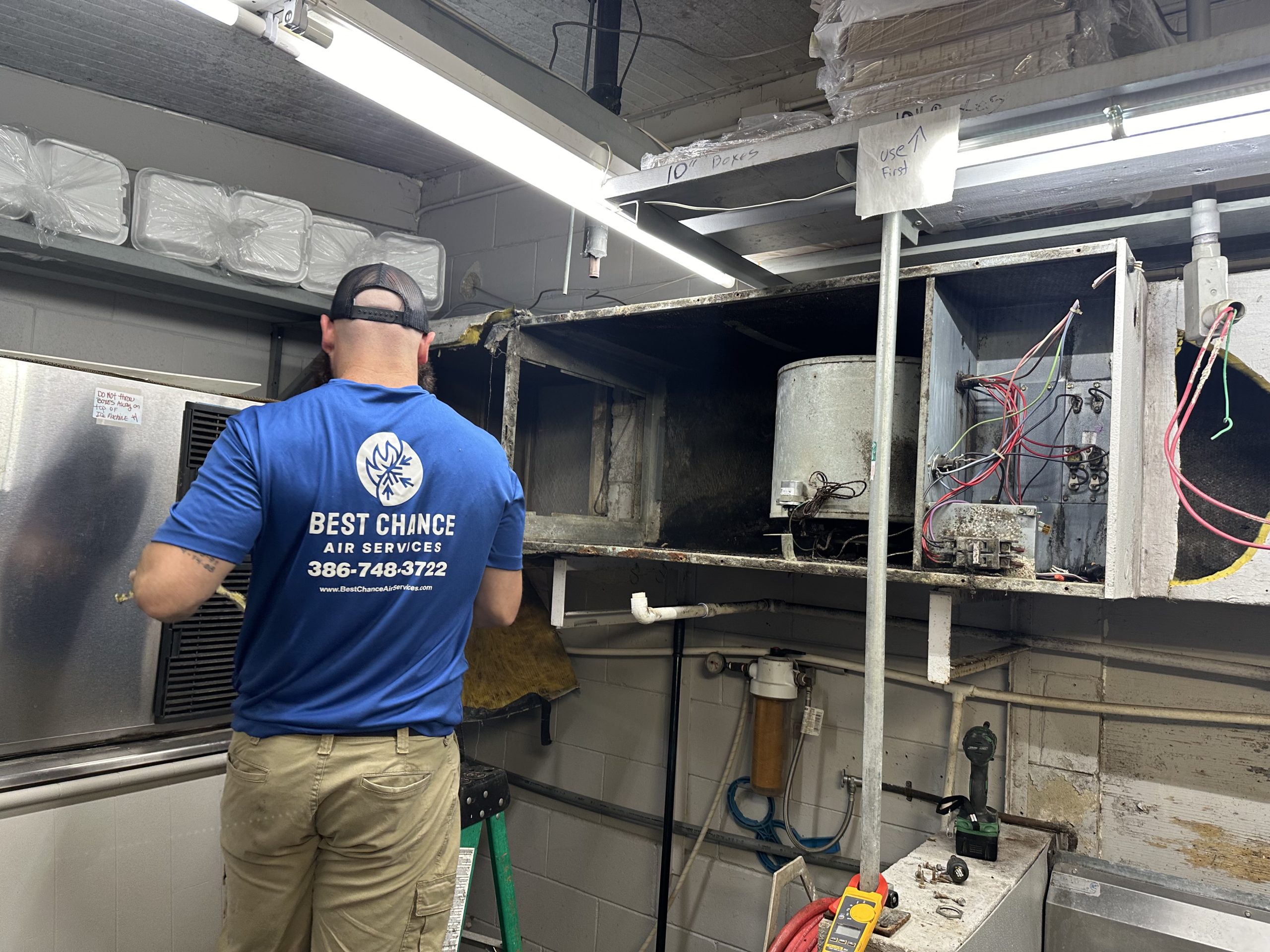 Best Chance Air Services technician working on commercial HVAC